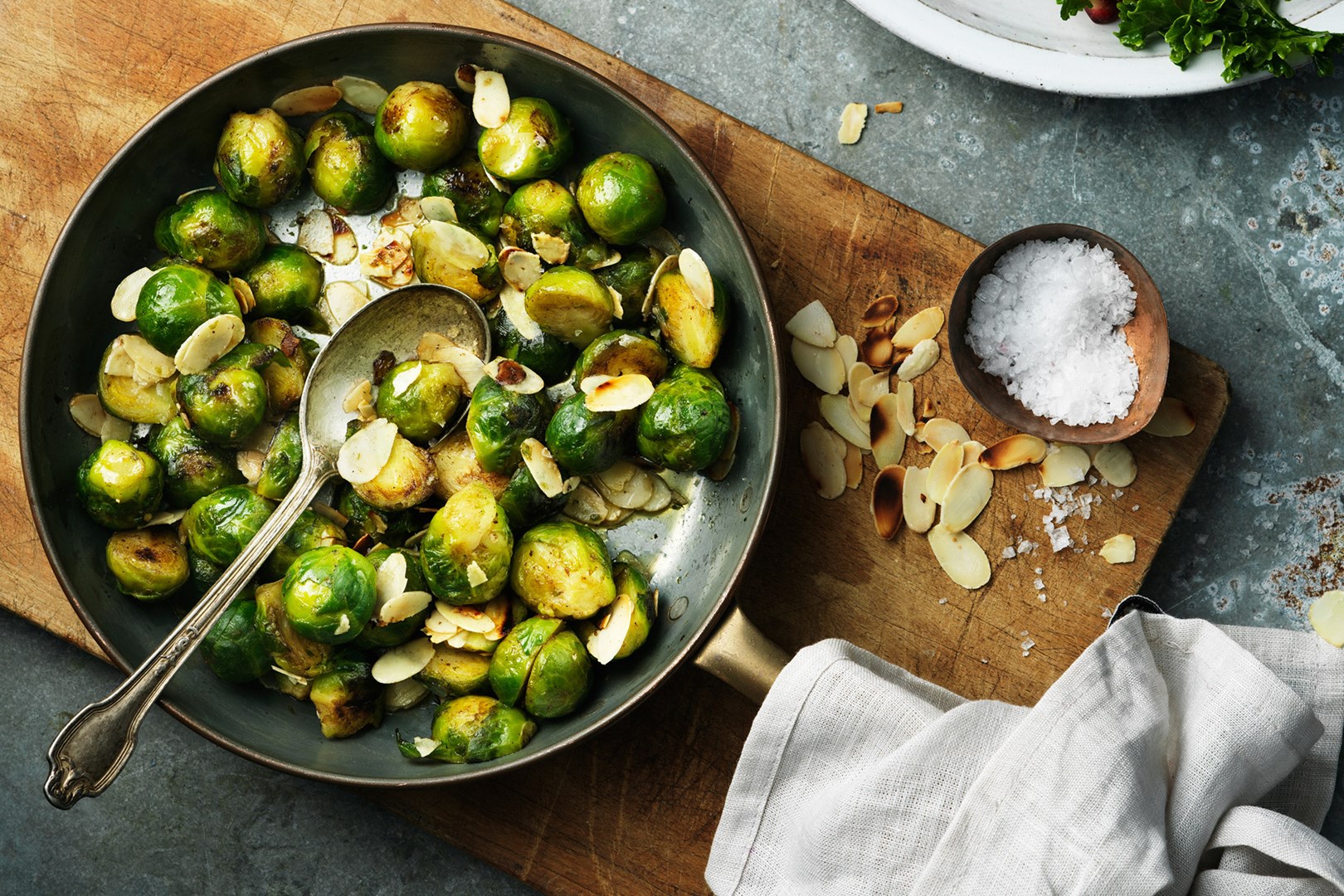 A pan with brussels sprouts and almonds