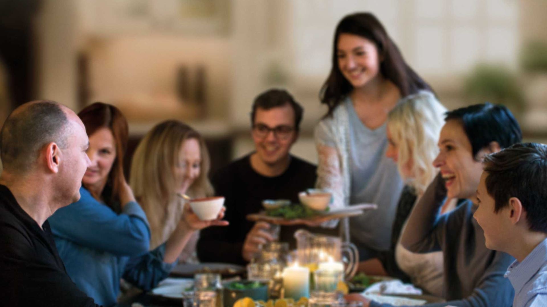 Happy people eating dinner