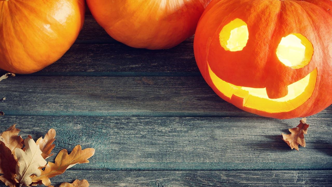 Halloween pumpkin and autumn leaves