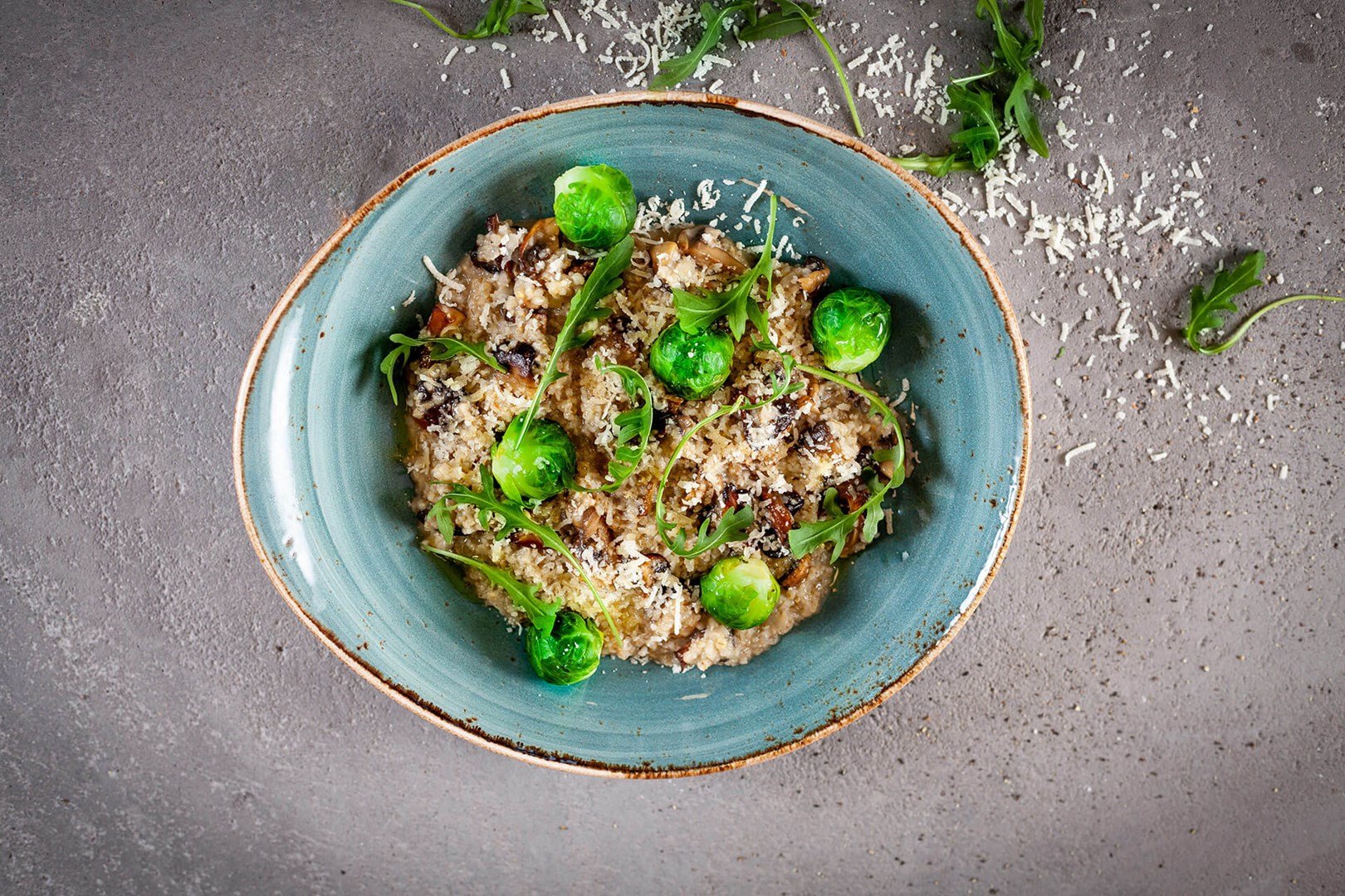 Dish with pearl barley risotto with mushrooms and brussels sprouts