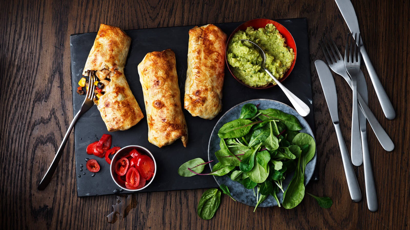 Three Chimichangas with guacamole and salad