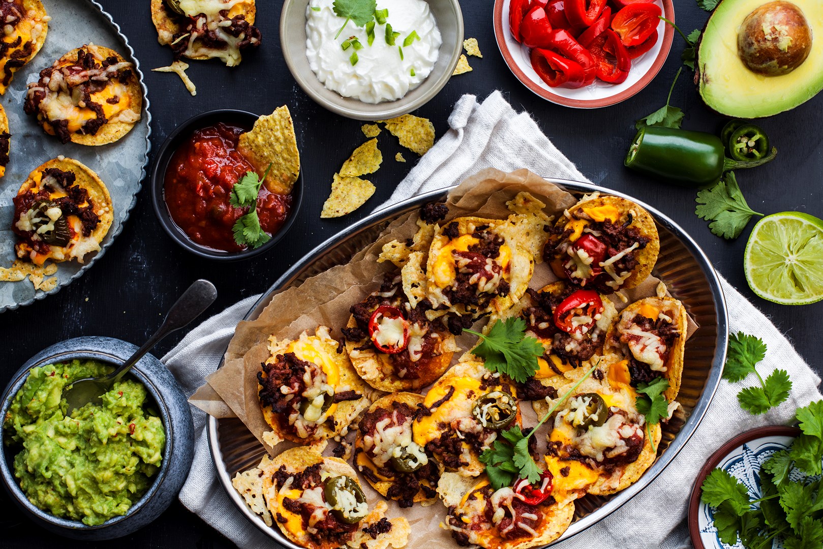 Nacho plate with taco mince, cheese, jalapeños and guacamole