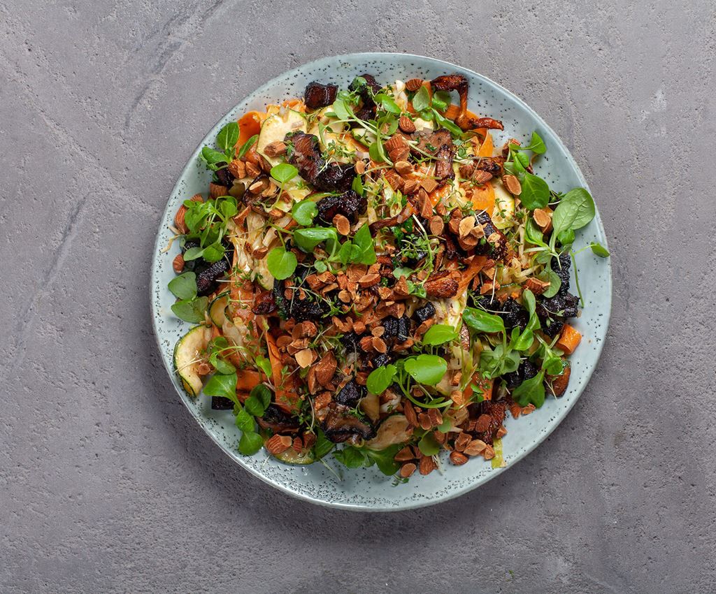 Plate with cabbage salad with pork belly