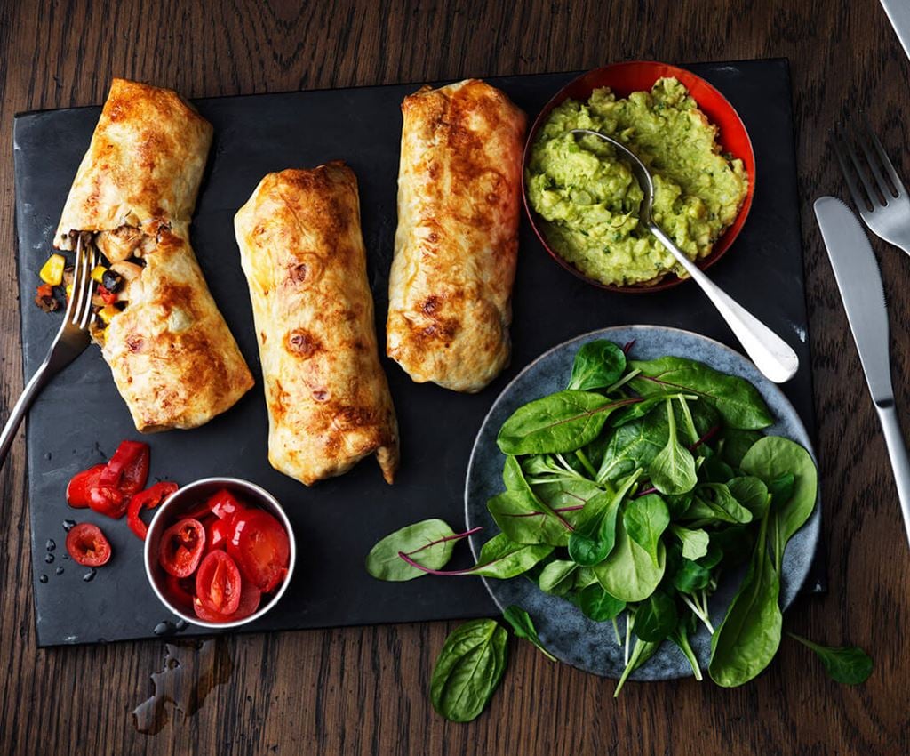 Three Chimichangas with guacamole and salad
