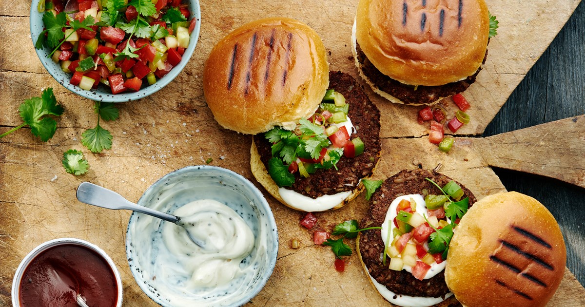 Charcoal grilled Black bean burger with Chilean pebre, vegan aioli & chipotle sauce